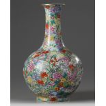 A Chinese famille rose millefleurs bottle vase