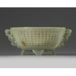 A Chinese celadon jade 'poetic' twin-handled bowl