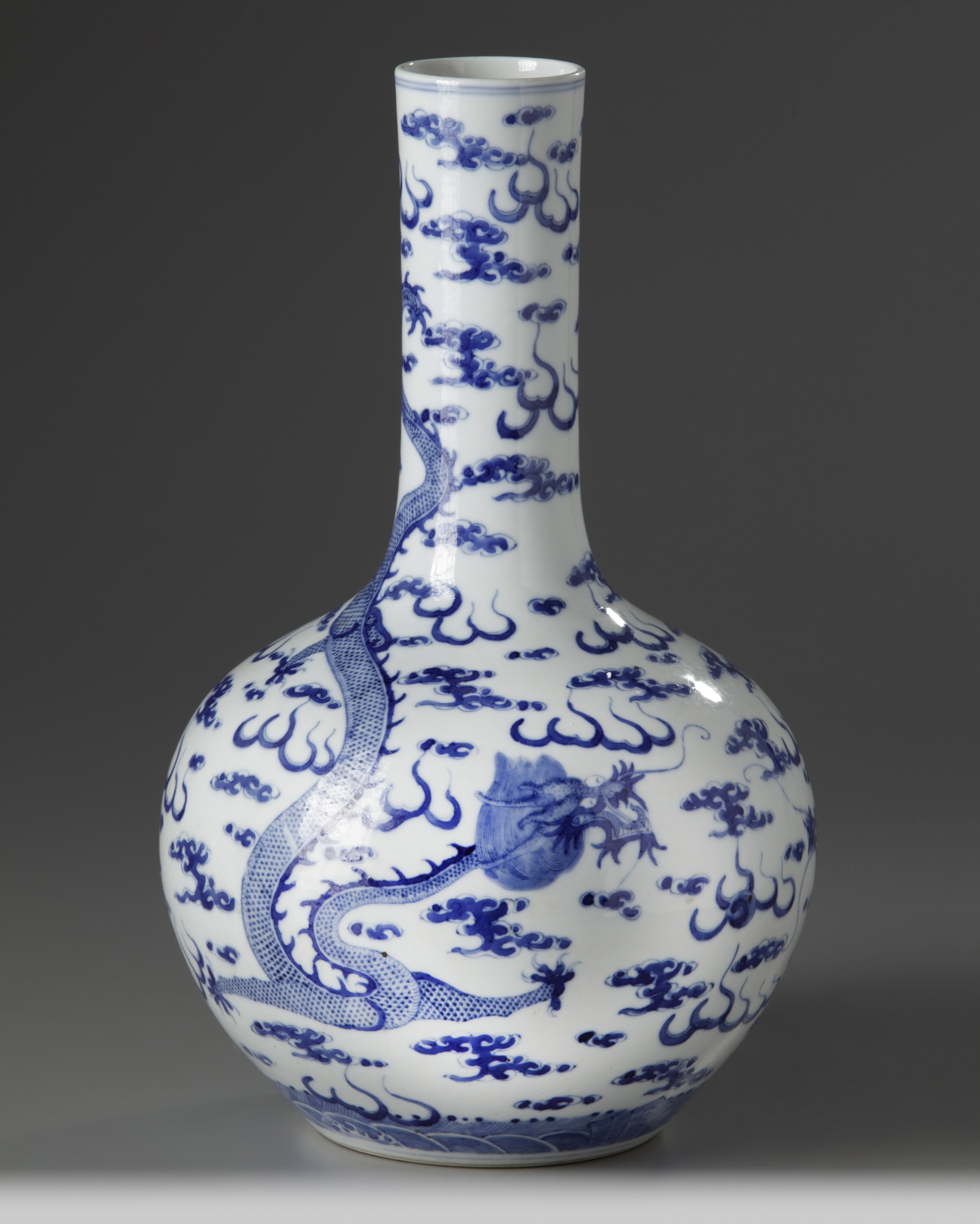 A Chinese blue and white 'dragon' bottle vase