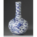A Chinese blue and white 'dragon' bottle vase