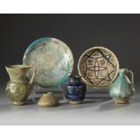 A group of four Islamic jugs and two bowls