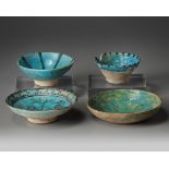 Three Islamic turquoise glazed bowls and a dish