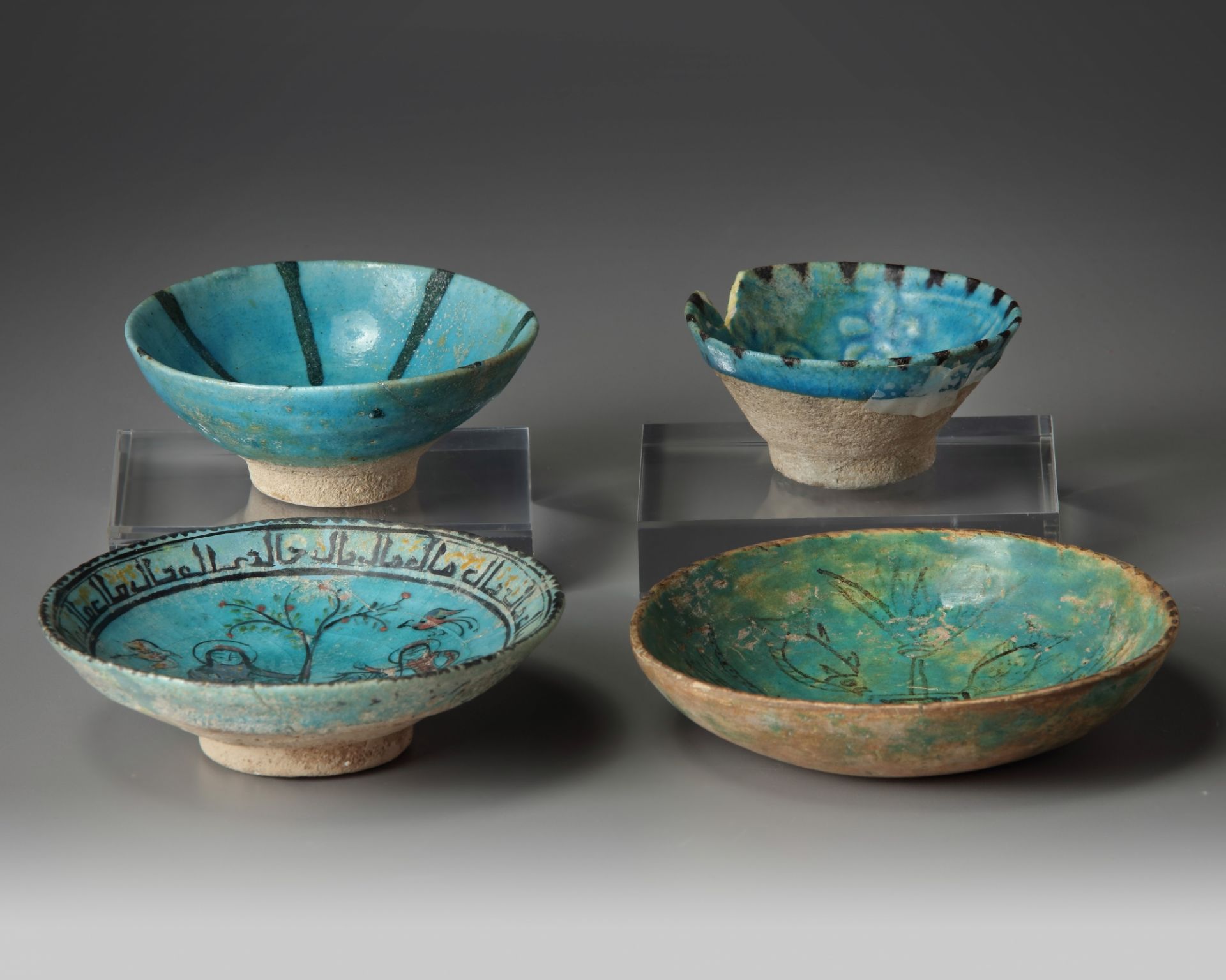 Three Islamic turquoise glazed bowls and a dish