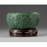 A Chinese spinach green jade 'nine dragons' bowl