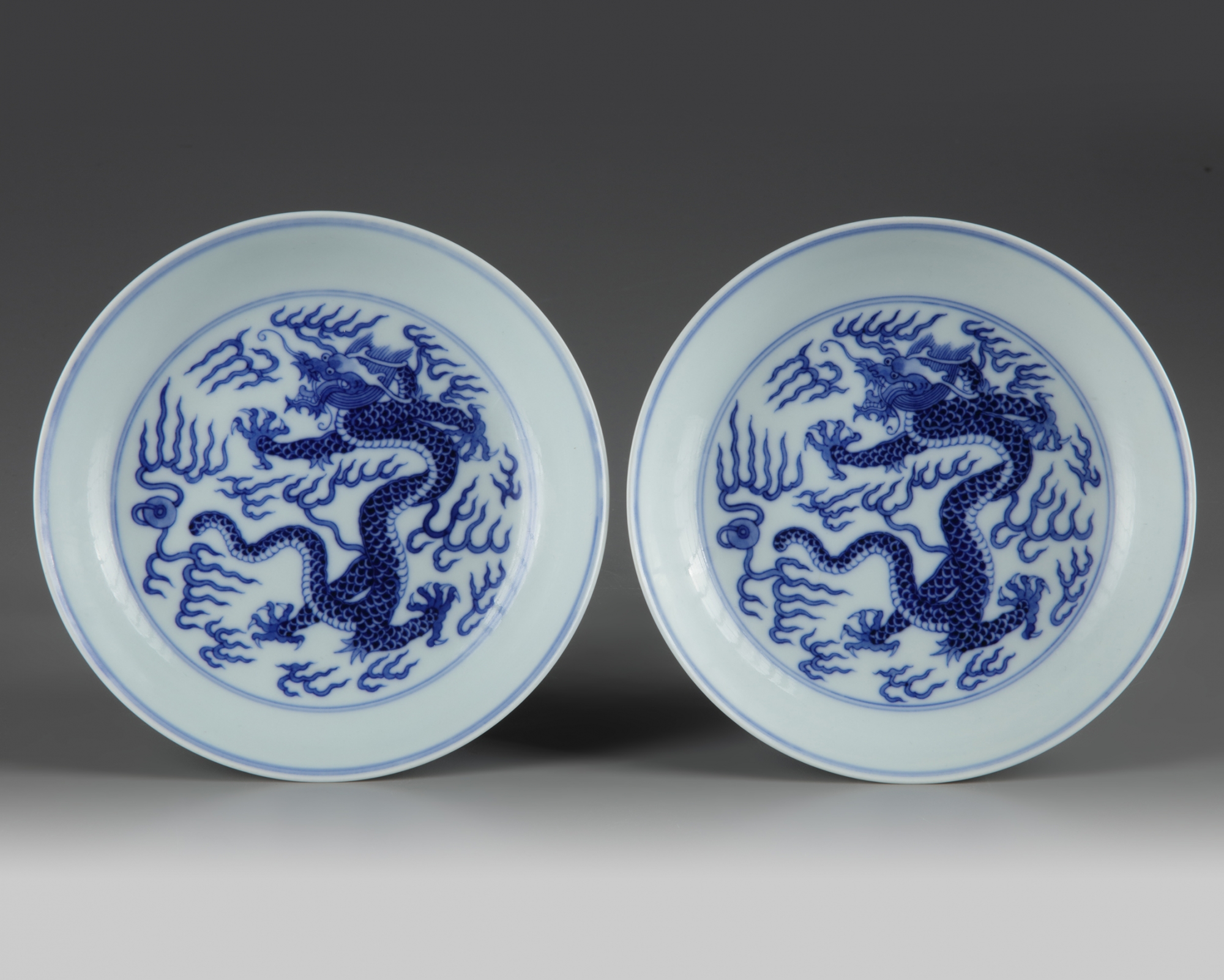 A pair of Chinese blue and white 'dragon' dishes