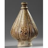 An Islamic Kashan pottery lobed vase
