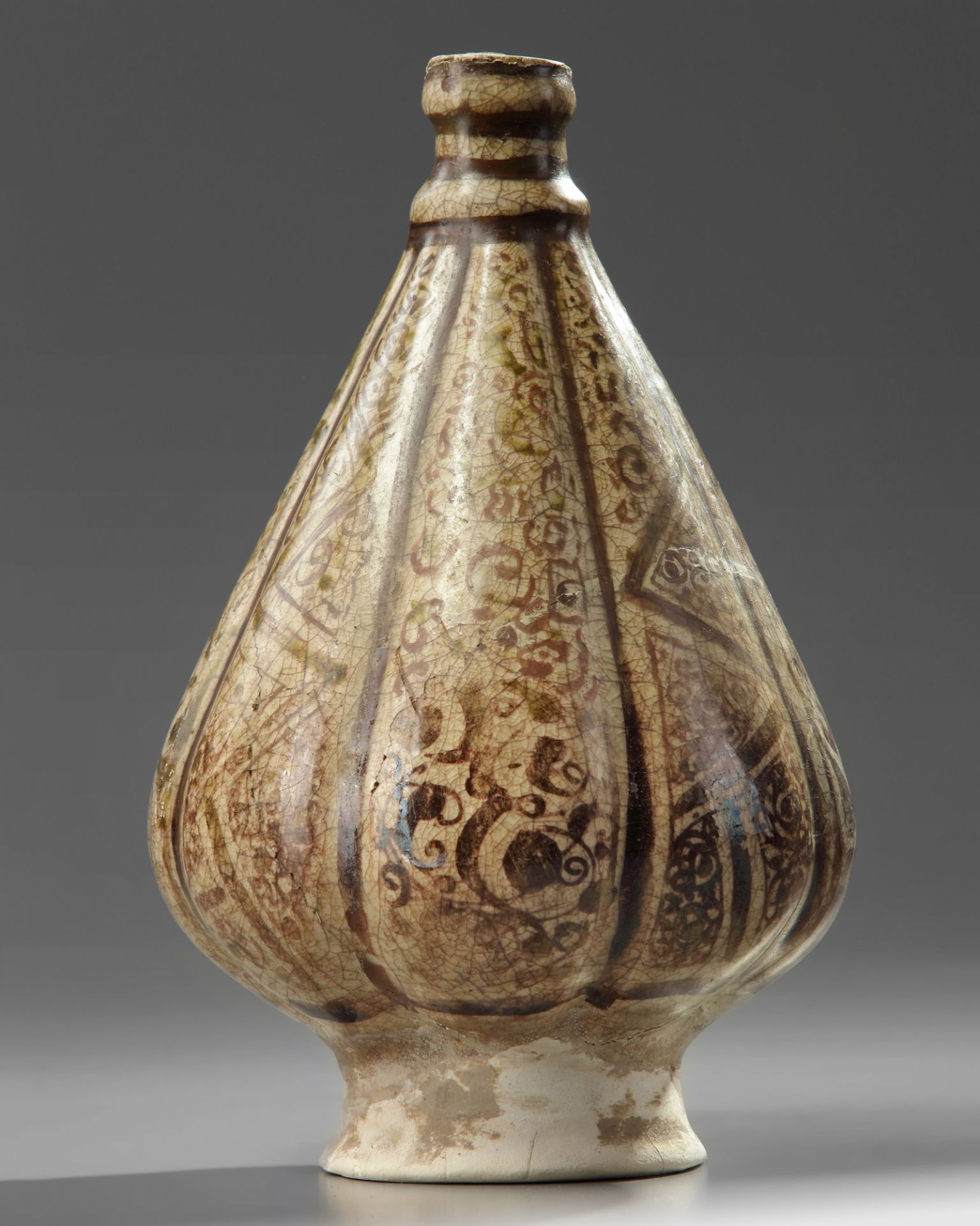 An Islamic Kashan pottery lobed vase