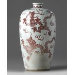 A Chinese underglaze copper-red-decorated 'five dragon' vase, meiping
