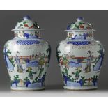 A pair of Chinese wucai vases and covers