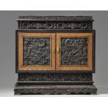 A small Chinese carved zitan cabinet