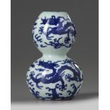 A Chinese blue and white ‘dragons’ double gourd vase