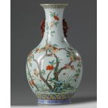 A Chinese famille rose ‘pomegranates’ bottle vase