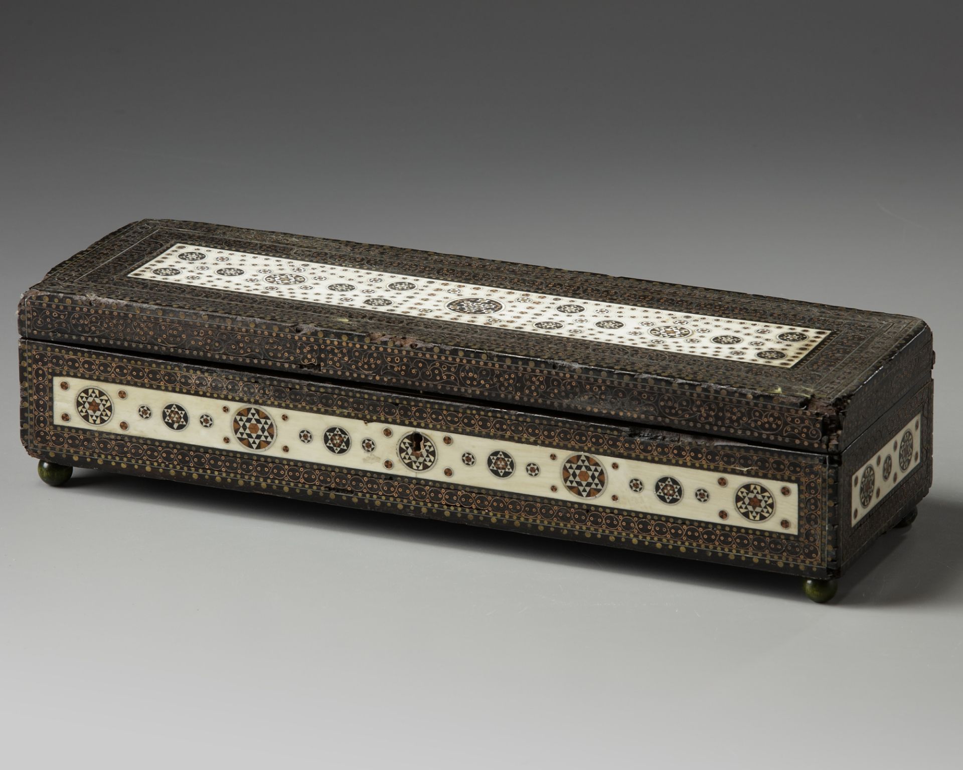 A silver and ivory inlaid wooden box