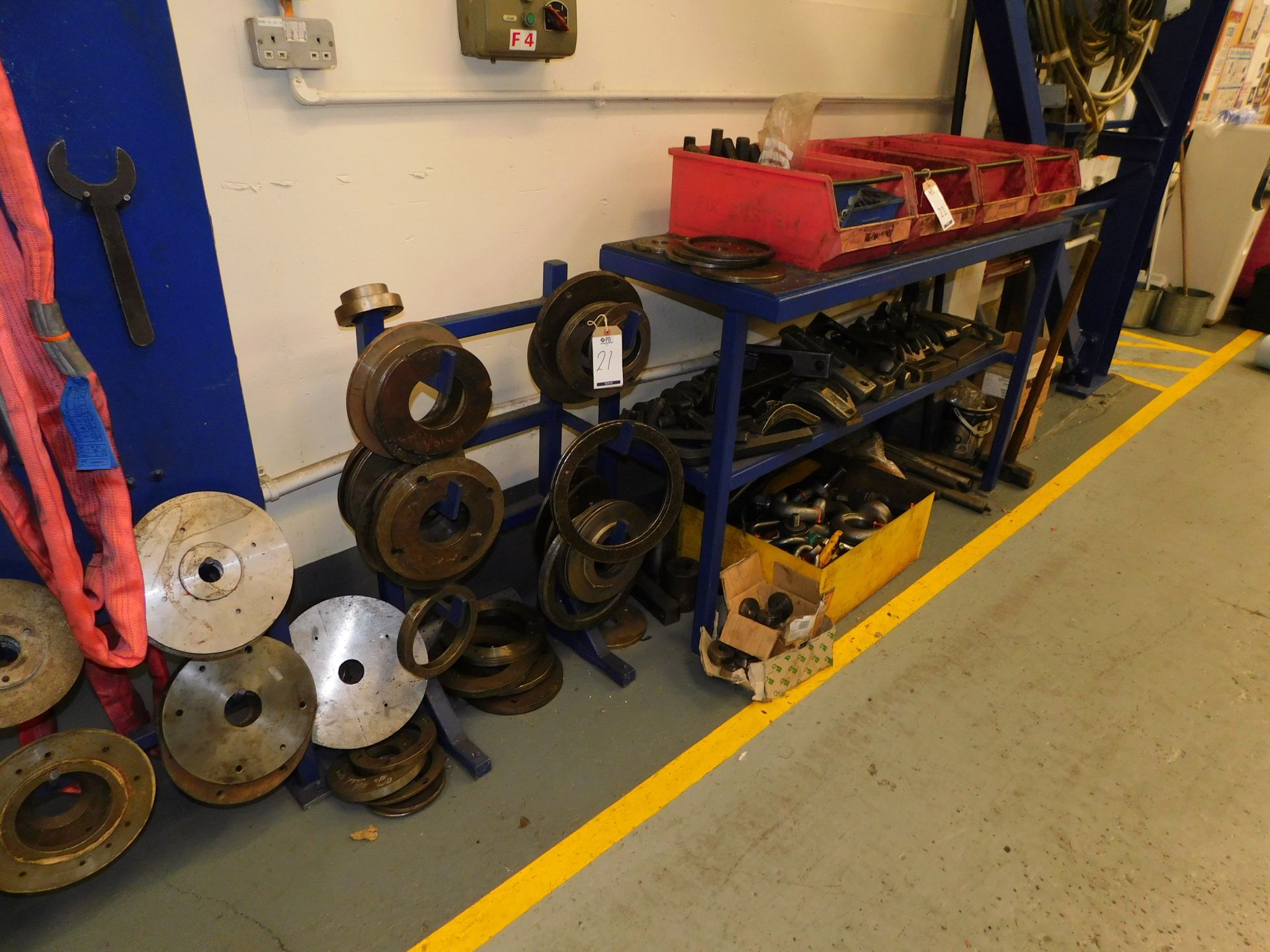 Quantity of Mould Clamps, Bolts & Mould Rings including Steel Bench & Rack