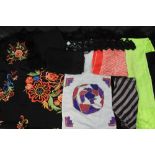 A collection of vintage scarves to include: a black fringed and floral embroidered shawl (damaged),