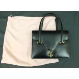 Black leather vintage Hermés handbag with gold hardware marked Hermés Paris in gold to interior,