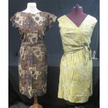 Five vintage printed dresses (50's-60's) to include: brown belted cotton African print dress,