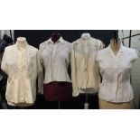 Seven vintage embroidered blouses to include: a short sleeve blouse with pale blue embroidery,