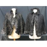 Two black Victorian capes, one with lace trim and an overlay of decorative piping and beading,