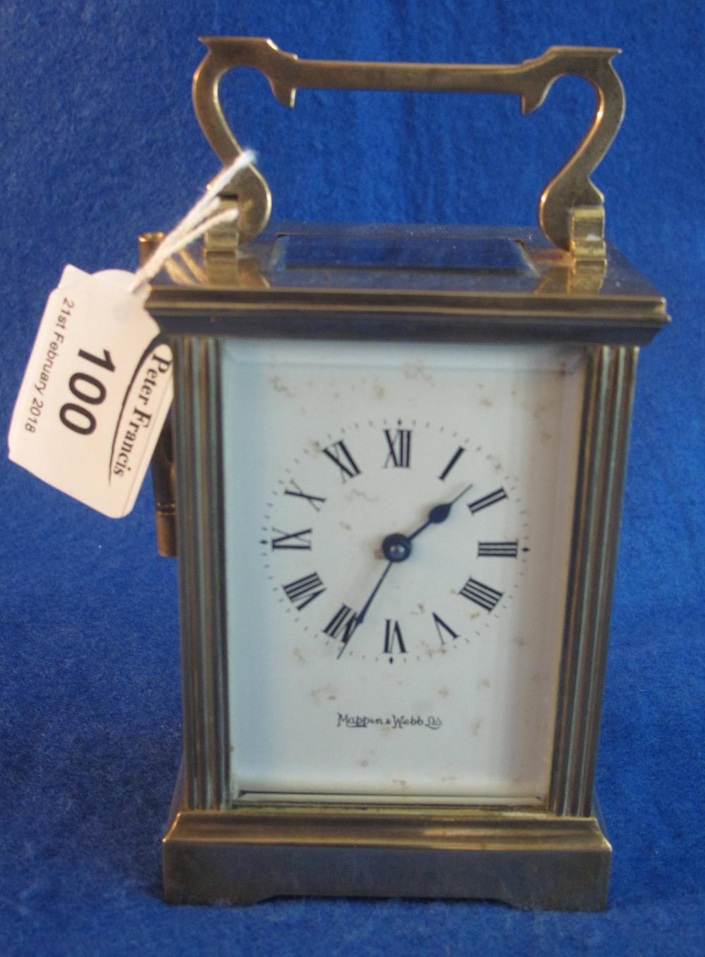 Mappin and Webb brass carriage clock with full depth Roman enamel dial, with key. (B.P. 24% incl.
