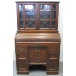 EARLY 20TH CENTURY OAK TWO STAGE ROLL TOP BUREAU BOOKCASE having astragal lead glazed bookcase top