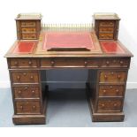 VICTORIAN MAHOGANY SLOPE FRONTED KNEEHOLE DESK with brass gallery pierced top,