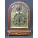 EARLY 20TH CENTURY MAHOGANY ARCH TOPPED, THREE TRAIN MANTEL CLOCK with brass face,