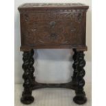 17TH CENTURY DESIGN CARVED OAK FALL FRONT BOX on associated stand,