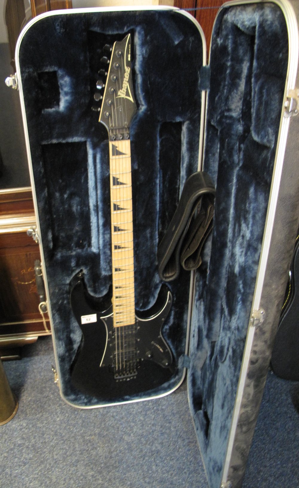 Ibanez RG series black 6 string electric guitar in original plastic hard case. (B.P. 24% incl.