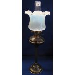 Glass double burner oil lamp with reeded pedestal on domed circular base,