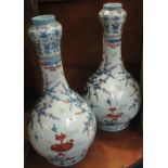 Near pair of large Chinese porcelain baluster shaped vases with garlic bulb necks,