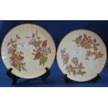 Two similar Royal Worcester porcelain plates painted and gilded with flower and foliage having