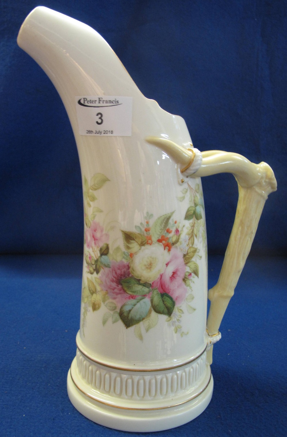 Large Royal Worcester porcelain horn shaped jug painted with flowers and foliage on an ivory ground,