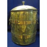 Large brass cylindrical coal bin and cover with lion mask loop handles. 55 cm high approximately.