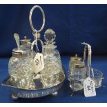 Silver plated boat shaped cruet stand with four cut glass bottles,