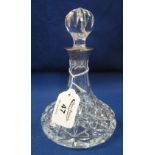 Small cut lead crystal glass ships type decanter and stopper with silver collar. 17cm high approx.