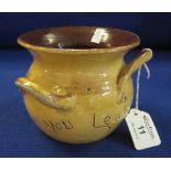 Ewenny pottery baluster shaped three handled jar with incised text "Learn to creep before you leap",