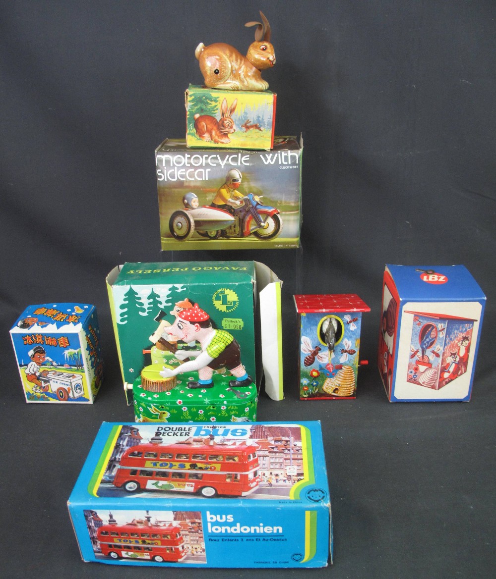 Group of vintage tinplate novelty toys,