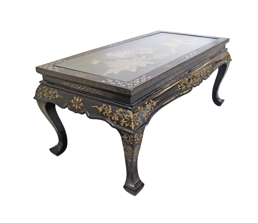 A Chinese black lacquer, painted and mother of pearl inlaid coffee table with collapsible legs. - Image 3 of 7