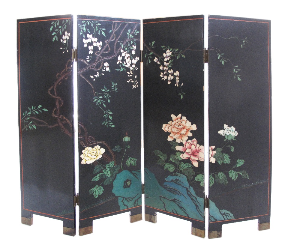 A Chinese four fold screen, black lacquer ground, carved decorations on both sides, flowers and