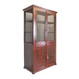 An early 20th century pantry cabinet with wire nets in all four sides above a two door cupboard.