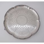 An engraved Sterling silver six lobbed salver, on three feet, Sheffield 1879. W37cm, Weight: 1200g