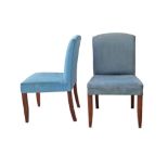 A pair of vintage armless cocktail chairs in blue upholstery, H86cm, W50cm, D51cm. (2)