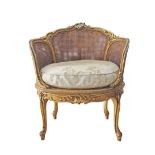 A French Louis XV - Rococo style carved and giltwood marquise en corbeille, oval cane seat and back,