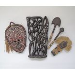 A collection of African artifacts comprising a hardwood carving H42cm, W22cm. (5)