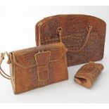 A collection of three vintage lady's crocodile skin hand-stitched handbags and clutch / pochette.