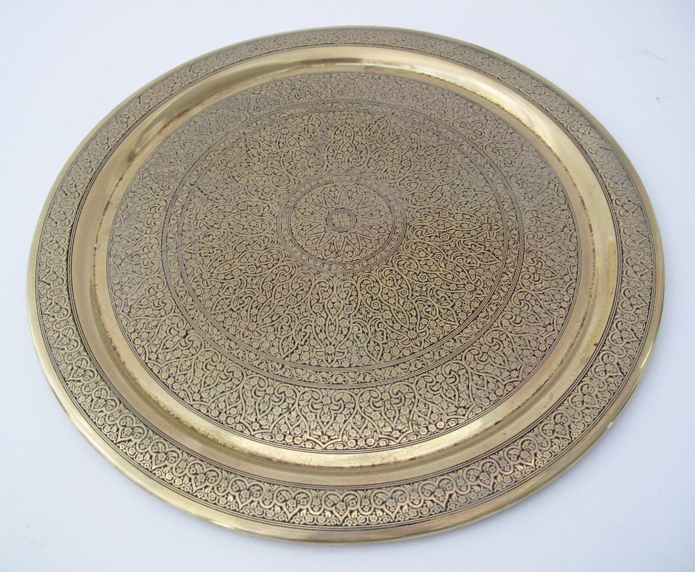 A collection of engraved brass artifacts comprising a round tray W36cm, a cigarette box, an ashtray, - Image 2 of 5