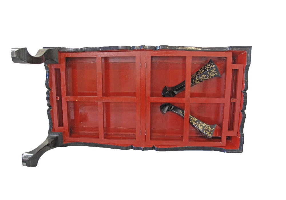 A Chinese black lacquer, painted and mother of pearl inlaid coffee table with collapsible legs. - Image 5 of 7