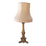 A giltwood side lamp in a pink shade. H60cm the base, H90cm with shade.