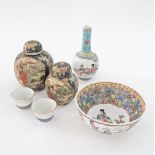 A collection of Asian porcelain comprising a pair of Japanese Kagiya sake cups, a Chinese bottle